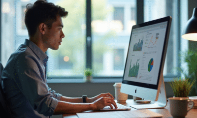 Jeune professionnel analysant des graphiques de données dans un bureau lumineux